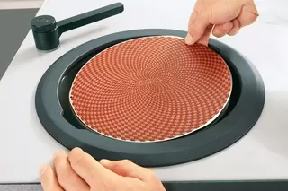 Ergonomically shaped splash guard ring